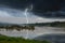 Strong lightning and black clouds over the river