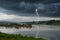 Strong lightning and black clouds over the river