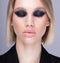 Strong make up on caucasian attractive model with closed eyes