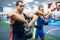 Strong male lifters doing exercise with kettlebell