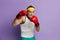 Strong Man Boxing In Gloves. Portrait of Senior Man Training