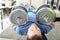 Strong man doing exercises with dumbbells on carpet