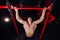 Strong man doing pull ups handsome athlete at gym. big confident muscular training.