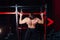 Strong man doing pull ups handsome athlete at gym. big confident muscular training.