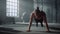 Strong man having sport challenge in gym. Male athlete making push ups on floor