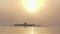 Strong man swims butterfly powerfully in a lake at sunset in slo-mo