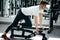 Strong man working with dumbbell in gym