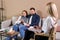 We are strong. Married couple sit close to each other while consulting with their doctor psychologist