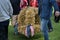 Strong men carry the traditional harvest crown made from cereal stalks to the festive area for thanksgiving