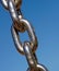 Strong metal chain against sky