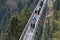 Strong metal ropes hold the suspension bridge, which are tourists in the German forest Schwarzwald