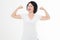 Strong middle age woman showing her muscularity and looking at camera isolated on white. Copy space and blank template t shirt