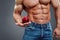 Strong Muscle Man holding a Red Apple