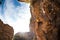 A strong rock climber is training on Turkish rocks, A woman climbs a climbing route