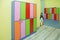 strong rows of color lockers in kindergarden dressing room in pool, children room . colorful of kid cabinet, wooden furniture for