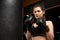 Strong sports lady boxer make boxing exercises in gym