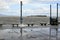 Strong stormy Winds and high tides cause lake water to rise pounding bay walk pier along the shore