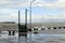 Strong stormy Winds and high tides cause lake water to rise pounding bay walk pier along the shore