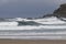 Strong swell with white foam at la Zurriola beach San Sebastian, Spain.