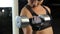 Strong woman building biceps muscles, doing dumbbell exercises, active workout