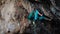strong woman rock climber climbs hard tough rock route on very overhanging black cliff in Turkey.