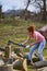 Strong woman  splitting beech logs