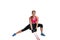Strong woman using a resistance band in her exercise routine. Young woman performs fitness exercises on white background