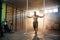 Strong young man screaming while making exercise with crossfit rope.