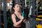 Strong young woman with beautiful athletic body doing exercises with barbell. Fitness, bodybuilding. Health care