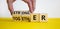 Stronger together symbol. Businessman turns cubes and changes the word together to stronger. Beautiful yellow table, white