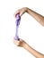 Strongly stretched lilac slime in the hands of a child isolated on a white background.