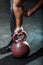 A strongman`s hand, holding gymnastic kettlebell