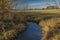 Stropnice river in color winter evening with sun and blue sky