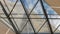 Structural glazing of the facade. Abstract background with glass ceiling elements in a modern building. view of the blue sky