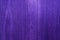 Structural wood background in purple color.