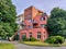 Structured building with shiny red facade