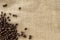 Structured linen background with roasted coffee beans