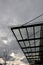 strut, suspended glass roof above the building entrance. bus station,