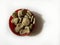 Strychnos nux vomica or poison nut seeds. It is also called Kuchala,Zahra, Kajra etc.