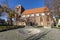 Strzelce Krajenskie, Lubuskie / Poland - November, 3, 2020: Old Catholic Church in the center of a small town. Brick Christian