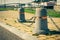 Stub posts linked in a chain on a quay