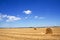 Stubble field and hay bales