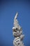 Stucco Art White Naga Heads With Blue Sky Background
