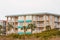 Stucco Condo with Green Roof and Awnings