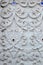 Stucco white sculpture decorative pattern wall design square format.