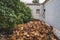 A stuck of chopped firewood in the courtyard of a country house. Preparing for winter