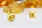 Stud earrings from natural baltic amber on white acrilyc surface