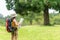 Student asian women and traveler with backpack adventure holding map to find directions location and leisure destination place in