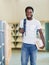 Student With Backpack And Books In Library