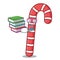 Student with book candy canes mascot cartoon